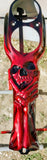 3d skull and hand stretching through harley console