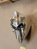Chrome Harley horn cover with punisher stretching through